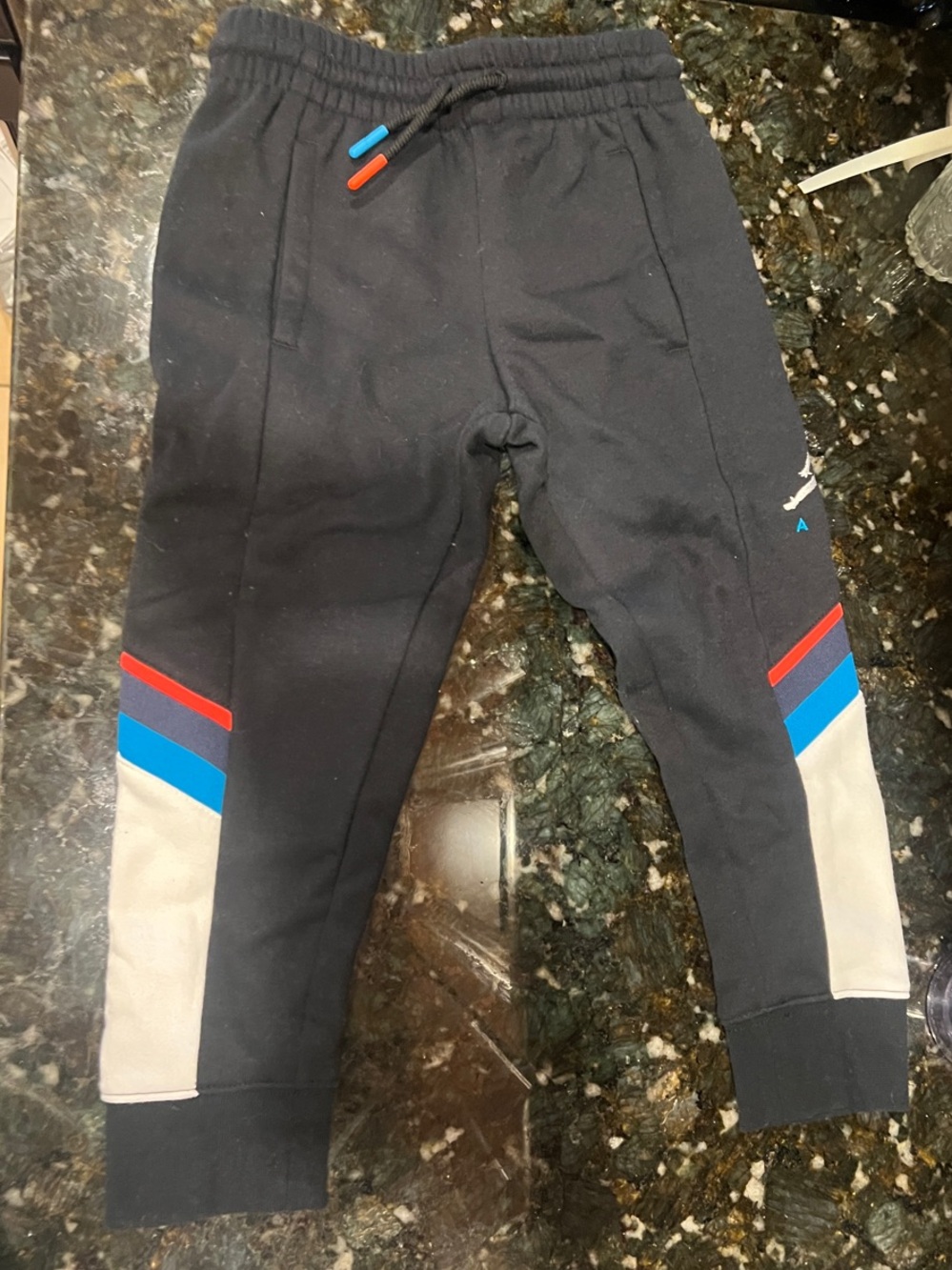 Jordan Kids Black Joggers with Red, Blue and Cream Accents